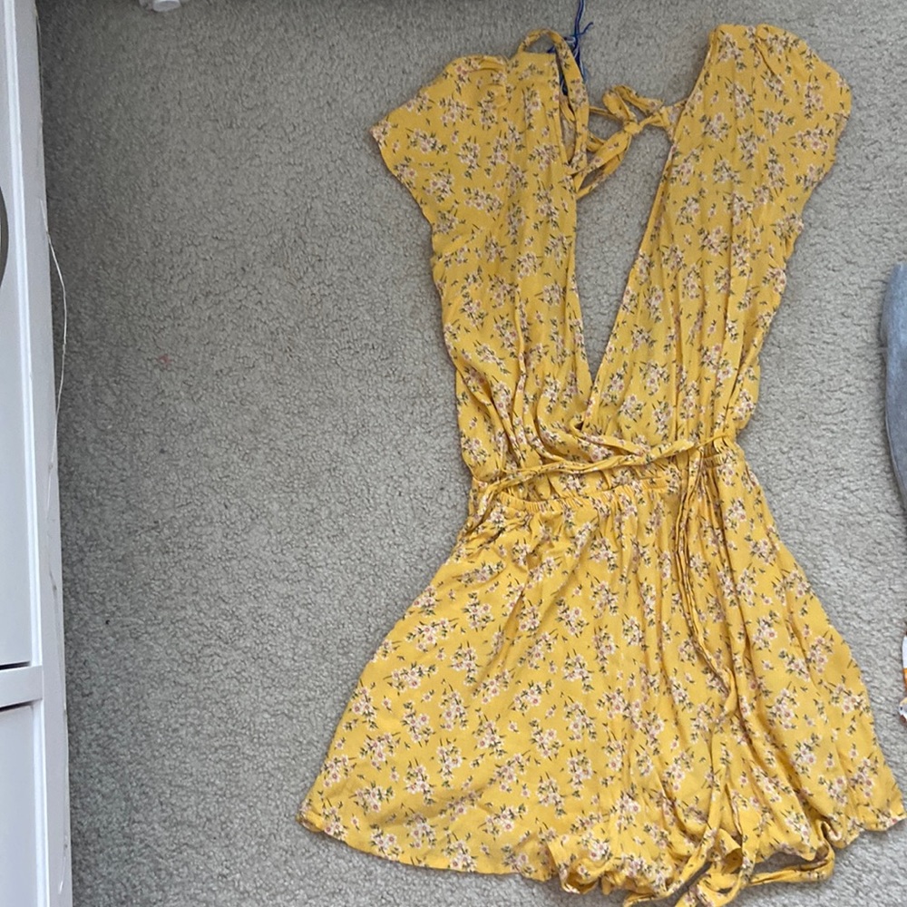 low v neck romper with floral design